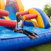 student on bounce house during Laker Kickoff